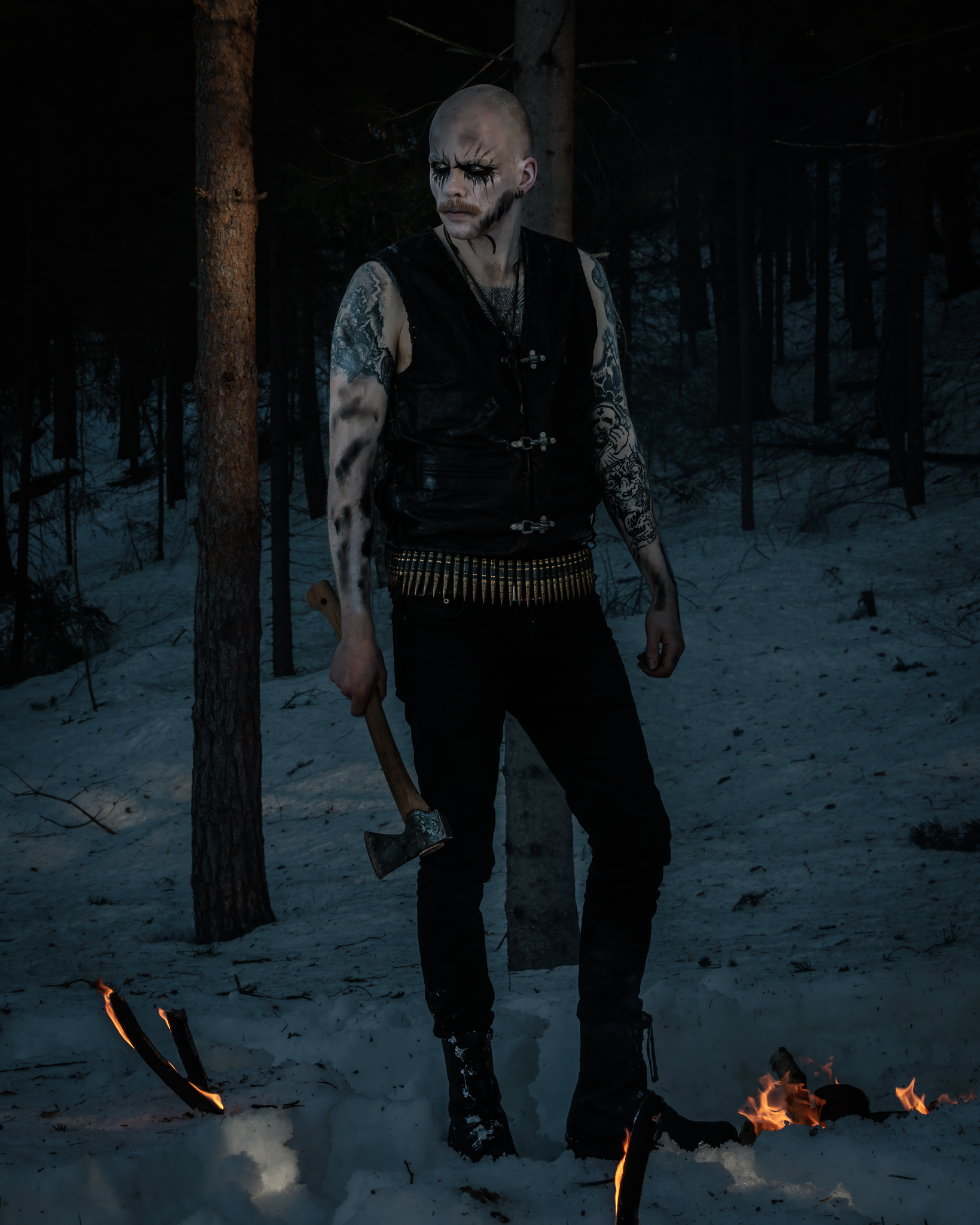 Doedskaldr in the woods holding an axe